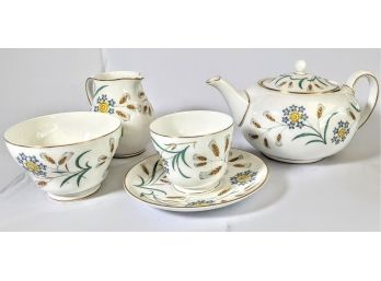 Set Of Fine China Dinner Plates, Tea Cups, Saucers, And Teapot By Wedgewood