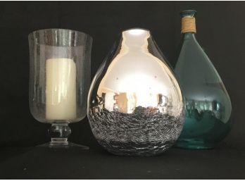 Three Decorative Items, Glass Hurricane Candle Holder, Silver Reverse Painted Vase, Decorative Bottle.