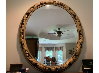 Large Oval Mirror In Ebony And Gilt Frame