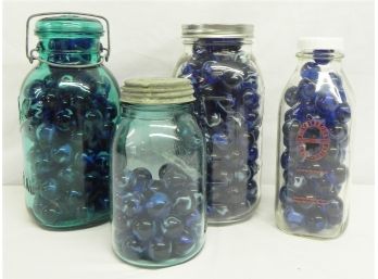 Collection Of Blue Jay Marbles Contained In Ball Mason Jars And Ronny Brook Dairy Farm Milk Bottle