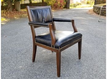 A Vintage Leather And Hardwood Arm Chair