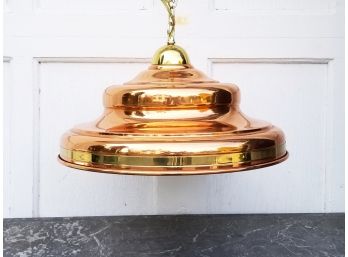 A Copper And Brass Light Fixture