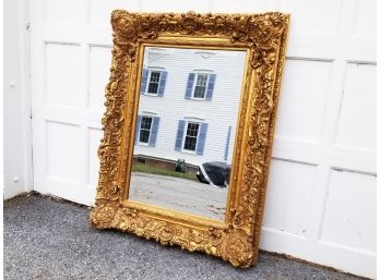 A Large Ornate Gilt Framed Mirror