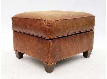 A Tawny Leather Ottoman Or Coffee Table