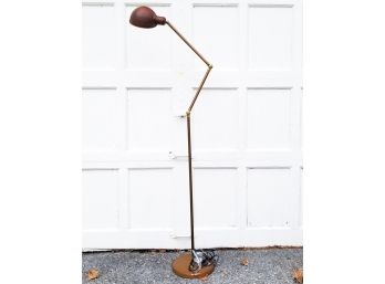 A Brass And Copper Tone Standing Lamp