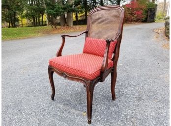 A Cane Backed Upholstered Arm Chair