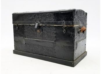 An Antique Embossed Metal Covered Travel Trunk