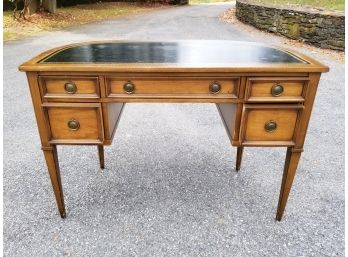 A Vintage Sligh-Lowry Bow Form Leather Top Desk