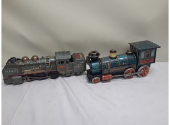 Two Vintage Motorized Tin Toy Trains