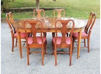 An Antique Mahogany Dining Table And Chairs