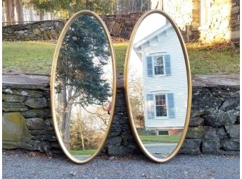 A Pair Of Vintage Gilt Framed Oval Mirrors