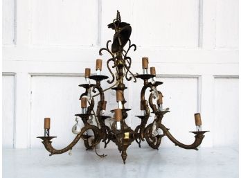 An Antique Brass And Crystal Chandelier