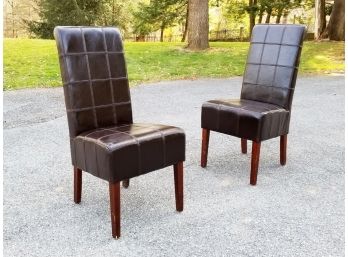 A Pair Of Tufted Leather Side Chairs