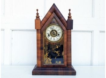 An Antique Inlaid Wood Clock From The Waterbury Clock Company