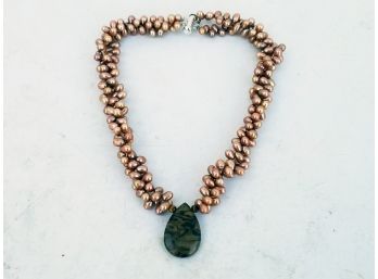 A Pearl And Stone Necklace