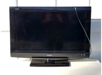 A Sharp Aquos 31' Flat Screen TV