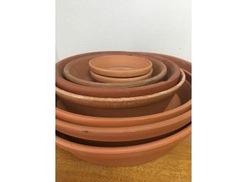 8 Planter Saucers In Both Terracotta And Plastic