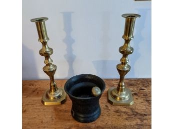 Antique Ironstone Mortar And Pestle Plus Pair Of Brass Candle Holders.