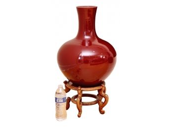 Large Glazed Oxblood Bulbous Form Porcelain Vase On Carved Wood Stand
