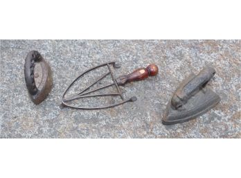 (2) ANTIQUE HAND IRONS AND IRON TRIVET