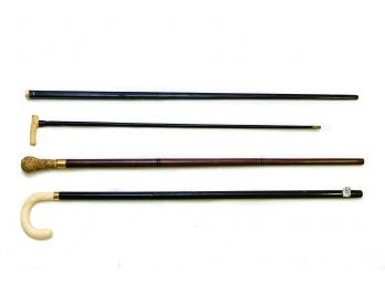 Sulka Walking Stick With 18K Gold Ring And Three Canes With Carved Knobs And Handles