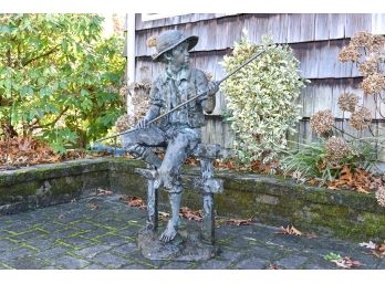 Bronze Patinated Statue Of Boy Fishing (or Holding A Stick) Sitting On A Fence**