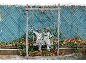 Patinated Bronze Sculpture Of Children On A Swing**