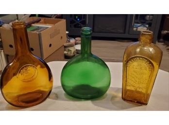 3 Vintage Colored Glass Bottles In The Fashion Of Earlier Antique Versions Of Their Designs