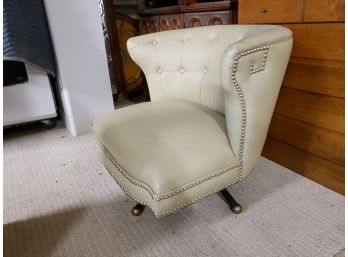 Low Beige Leather Armless Swivel Chair