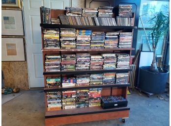 HUGE Lot Of Assorted DVDs CDs On Double Sided Rolling Rack