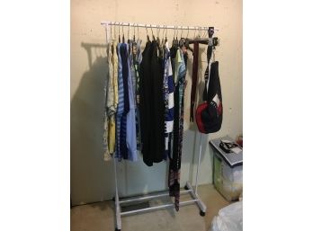 Clothing Rack With Mens And Womens Clothing Including Hawaiian Shirts And A Suit By Neiman Marcus