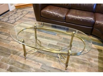 Beveled Edge Glass Coffee Table With A Brass Frame