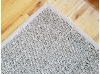 A Woven Seagrass Rug By Safavieh