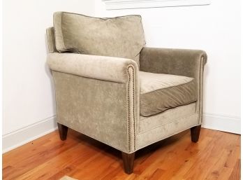 A Modern Velvet Upholstered Armchair With Nailhead Trim