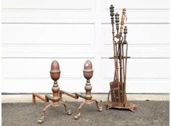 A Pair Of Brass Fireplace Andirons And Tools