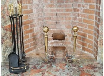 A Pair Of Brass Andirons And Wrought Iron Fireplace Tools