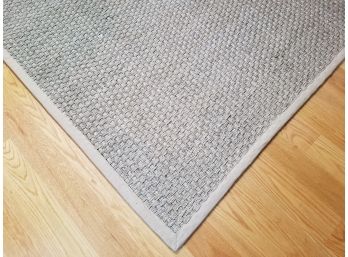 A Woven Seagrass Rug By Safavieh