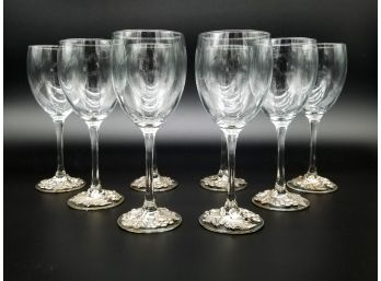 A Set Of Crystal Wine Goblets With Leaf Motif Silver Bases