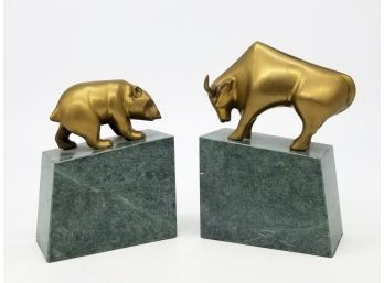 A Pair Of Antiqued Brass Bull And Bear Bookends Mounted On Marble.