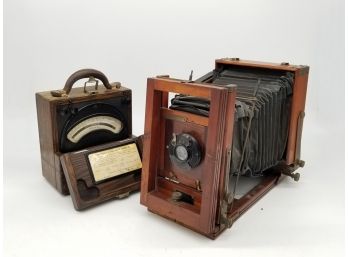 An Antique Camera And Voltometer