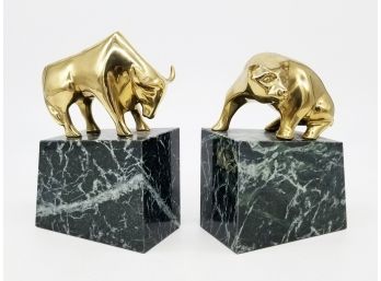 A Pair Of Polished Brass Bull And Bear Bookends Mounted On Marble.