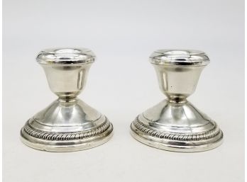 A Pair Of Vintage Weighted Sterling Candlesticks