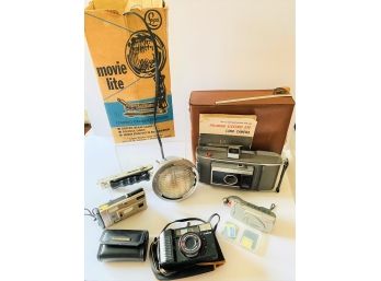 Vintage -some Newer Camera Lot - Canon, Olympus, Minolta, Cyber Shot Charger, Polariod, Movie Lite UNTESTED