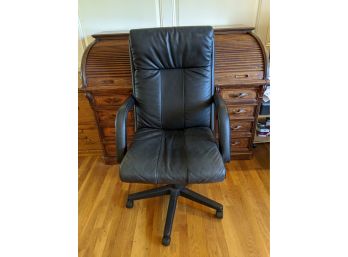 Black Leather Office Chair Tilts Back And Rolls