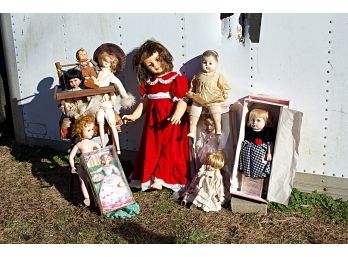 Group Of Dolls And A Wooden Hi-chair