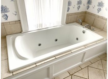 Jetted Whirlpool Tub And Polished Chrome Faucet With Handheld Sprayer