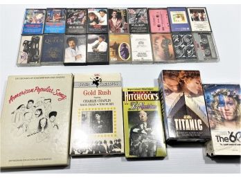 Group Of Various VHS & Cassette Tapes Including The Rolling Stones, Michael Jackson, Aerosmith, Titanic, Etc