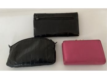 Pair Of Wallets And Black Travel Pouch