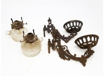 A Pair Of Antique Oil Lamps And Cast Iron Holders