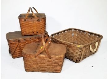 A Collection Of Antique Picnic Baskets